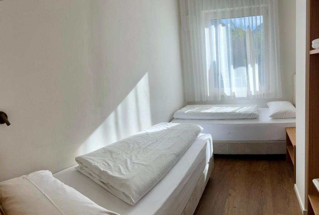 Postel nebo postele na pokoji v ubytování Hotel Gartenresidence Zea Curtis