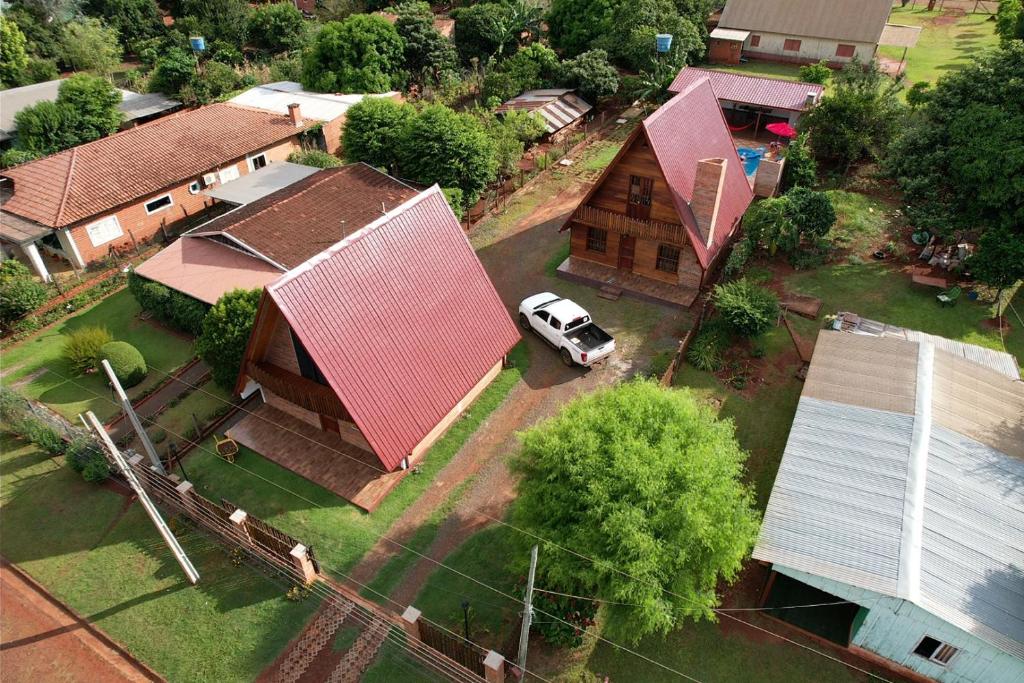 an aerial view of a house with a car parked in the yard at Fi-Scheer Bungalows in Bella Vista