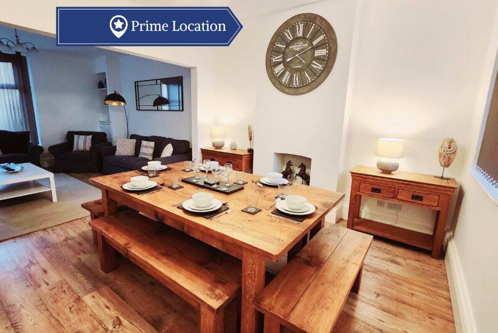 a living room with a wooden table and a living room at Beautiful 4BR Home near Chester Racecourse in Chester