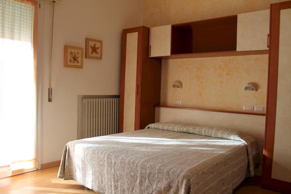 Postel nebo postele na pokoji v ubytování Hotel Turismo