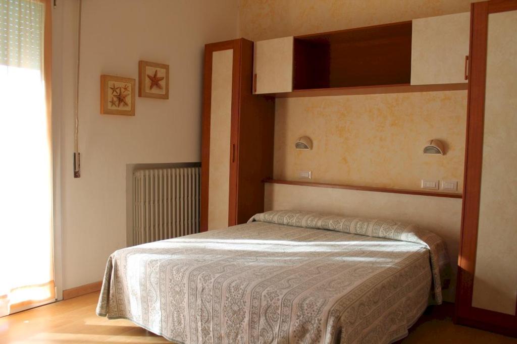Postel nebo postele na pokoji v ubytování Hotel Turismo