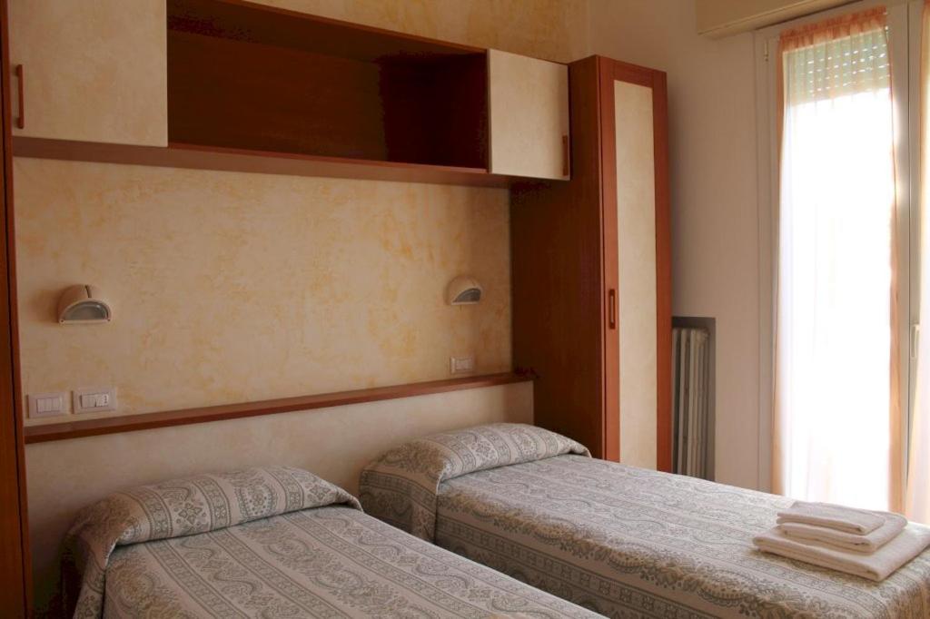 Postel nebo postele na pokoji v ubytování Hotel Turismo