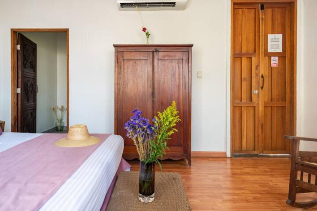 Postel nebo postele na pokoji v ubytování Casa Verde Hotel