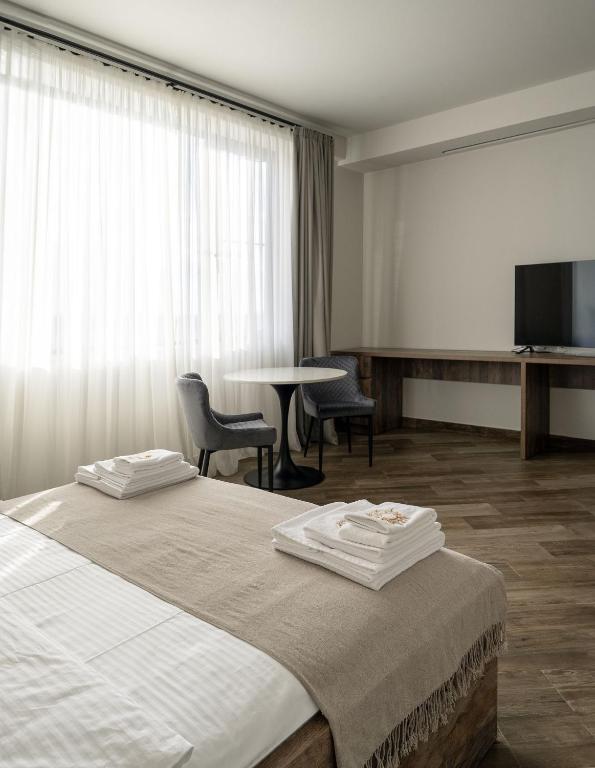 Postel nebo postele na pokoji v ubytování Eclipse Winery Boutique Hotel