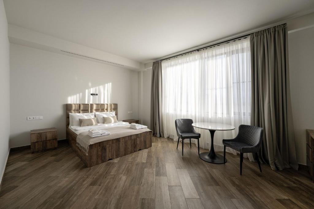 Postel nebo postele na pokoji v ubytování Eclipse Winery Boutique Hotel