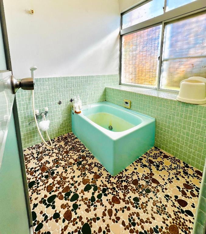 Koupelna v ubytování Guesthouse Azumaya