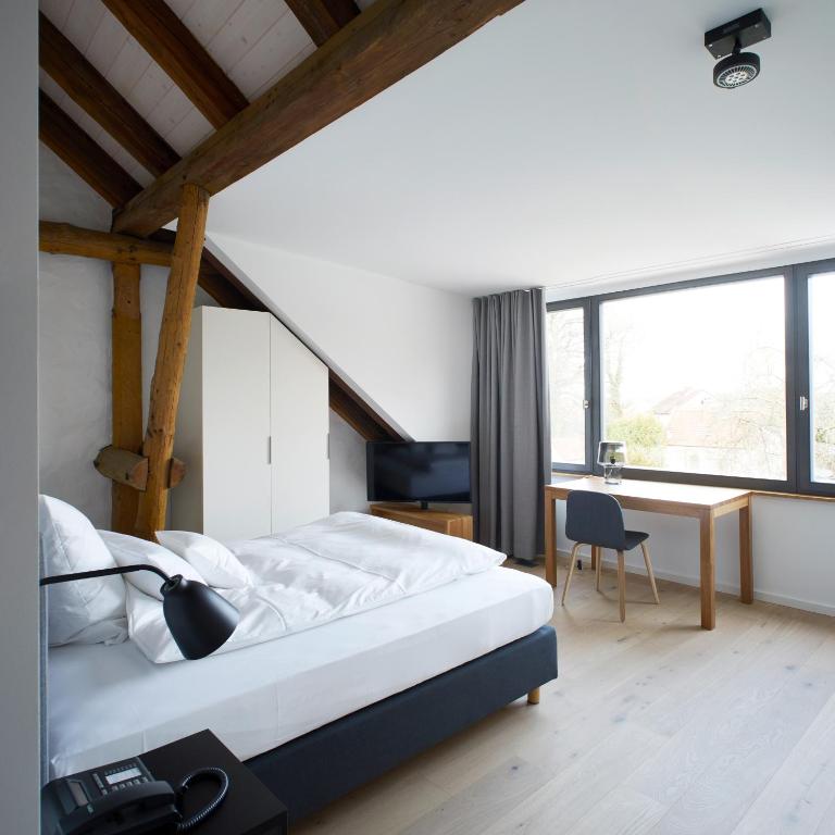 Postel nebo postele na pokoji v ubytování meinwolfsburg hotel auf dem rittergut vormals Yard Boarding Hotel