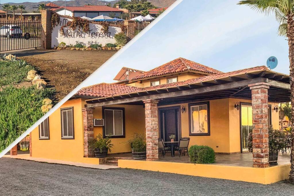 una pequeña casa amarilla con porche en Casa en los Viñedos., en Valle de Guadalupe