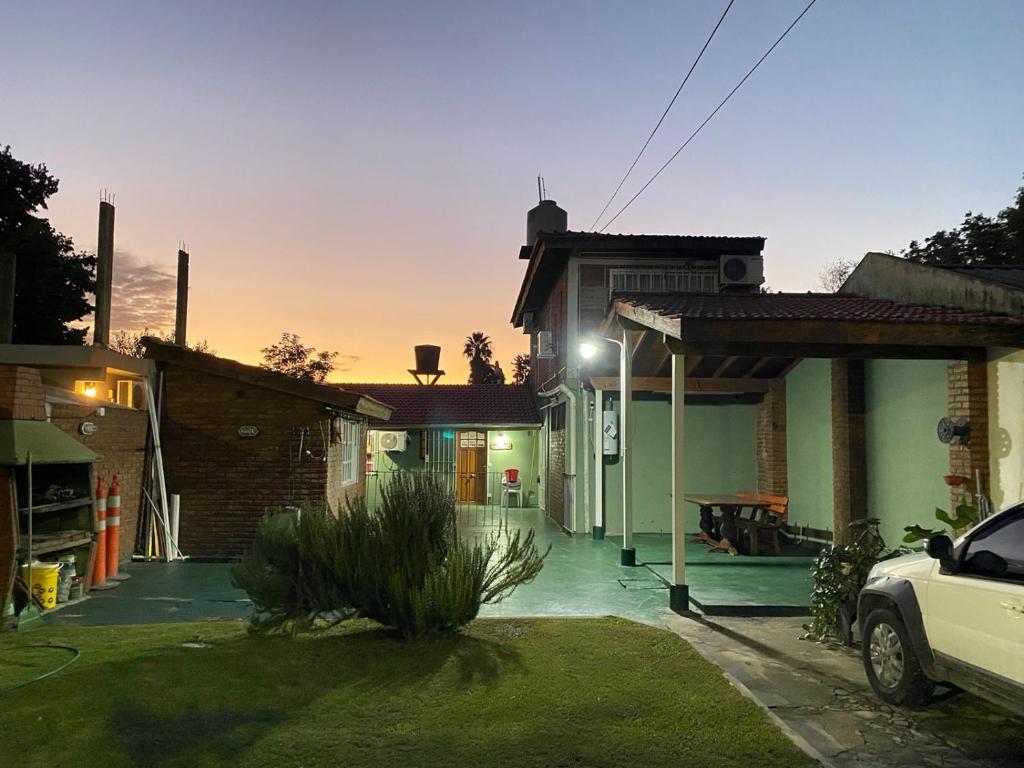 a house with a car parked in front of it at Hostel joel 2 in Moreno