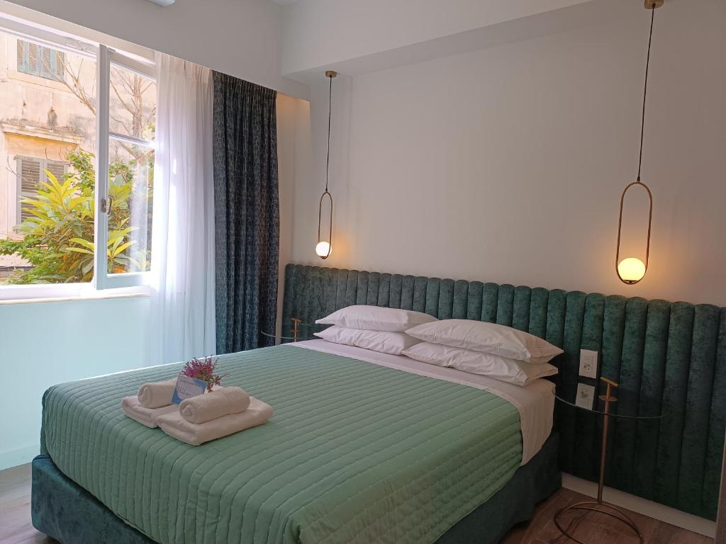 Postel nebo postele na pokoji v ubytování MUSES LUXURY SUITES
