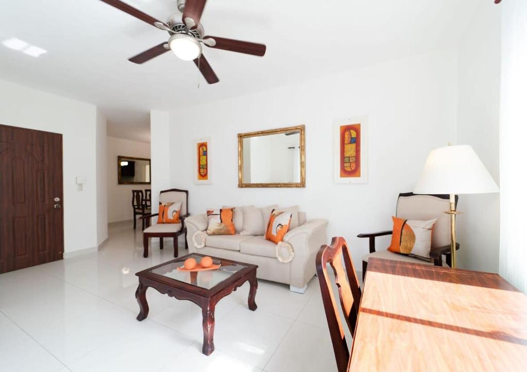 a living room with a couch and a table at Inviting 3-Bed 2-Bath in Las Flores