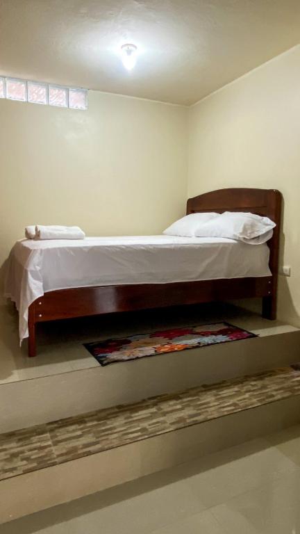 a bedroom with a bed in a room at Suite de Asdruval in Puerto Baquerizo Moreno