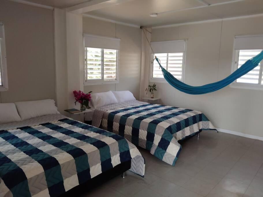Ένα ή περισσότερα κρεβάτια σε δωμάτιο στο Ecocontainer Paradise SMR