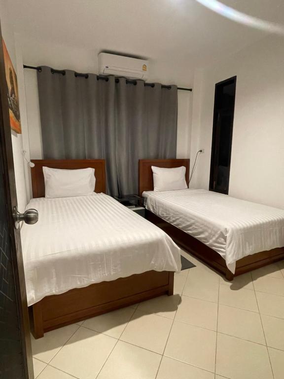 Postel nebo postele na pokoji v ubytování Aisawan Resort villa