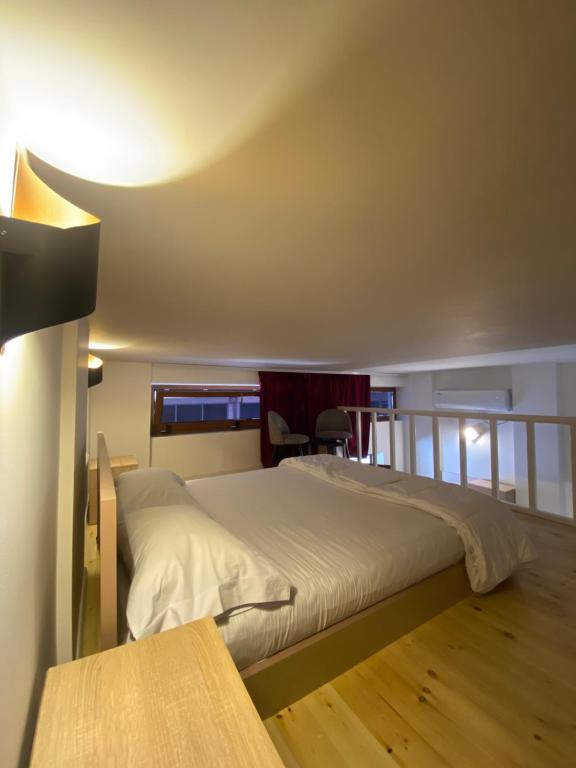 Postel nebo postele na pokoji v ubytování Guest Room Angolo Toscano