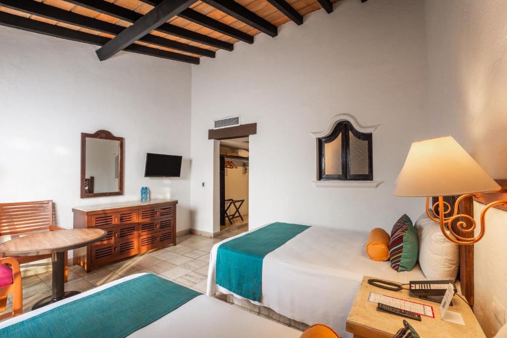 Postel nebo postele na pokoji v ubytování Hacienda Buenaventura Hotel & Mexican Charm - All Inclusive