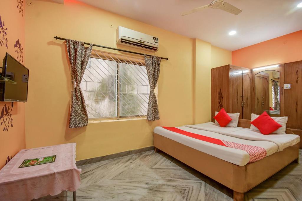 Postel nebo postele na pokoji v ubytování Super Hotel O Priyal Amrit Sagar