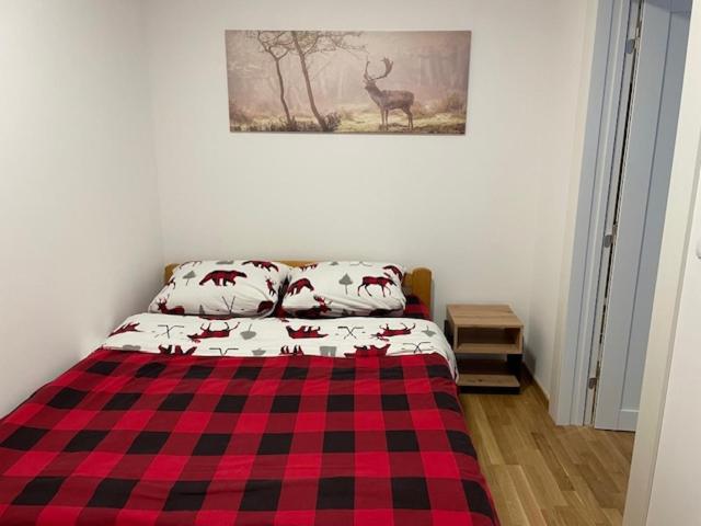 Una cama o camas en una habitación de Divčinova B15