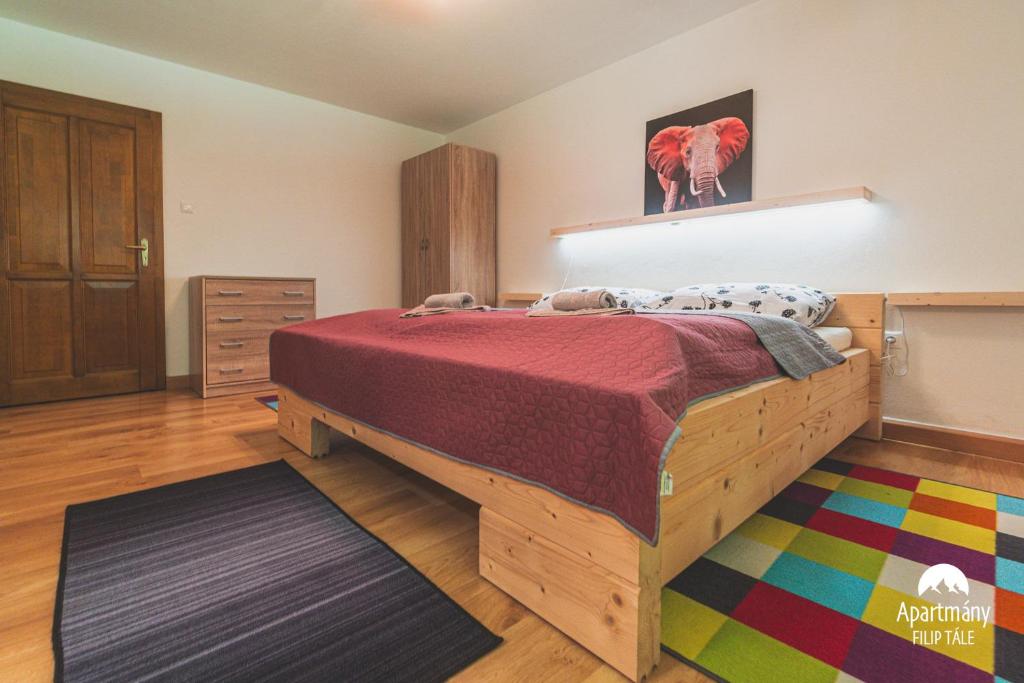Postel nebo postele na pokoji v ubytování Apartmány Filip Tále