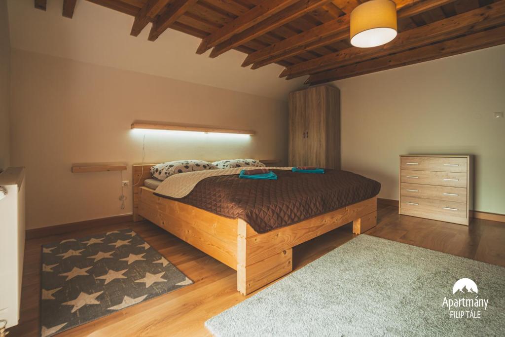 Postel nebo postele na pokoji v ubytování Apartmány Filip Tále