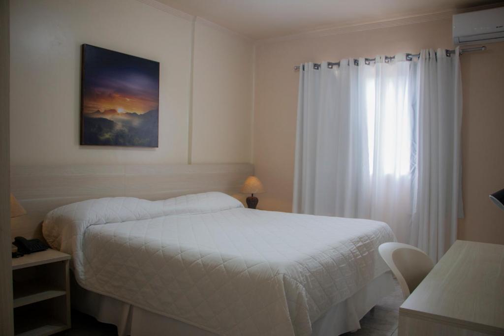Postel nebo postele na pokoji v ubytování Hotel Novoleste