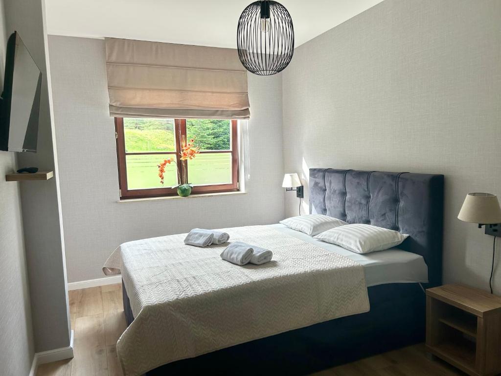 Posteľ alebo postele v izbe v ubytovaní Apartament w Rezydencji Pod Świerkami Karpacz