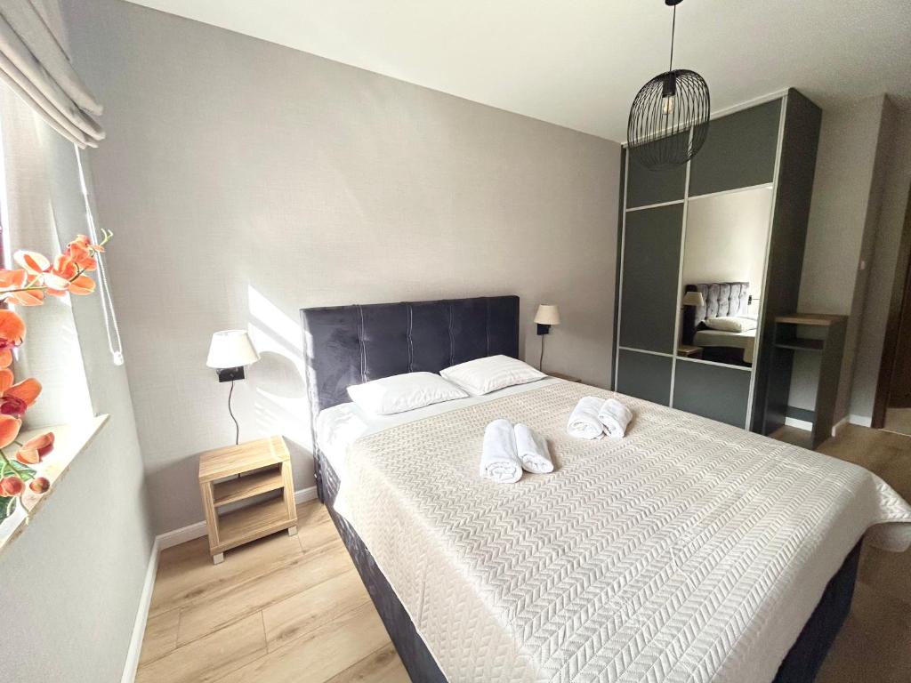 Posteľ alebo postele v izbe v ubytovaní Apartament w Rezydencji Pod Świerkami Karpacz