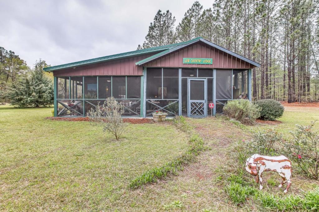 a barn with a cow in front of it at Tranquil Fairmont Studio with Patios - Pets Welcome! 