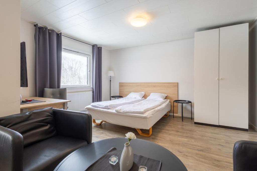 Postel nebo postele na pokoji v ubytování Halmstad Hotel Apartments