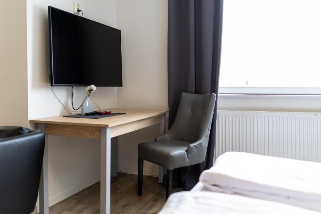 TV a/nebo společenská místnost v ubytování Halmstad Hotel Apartments