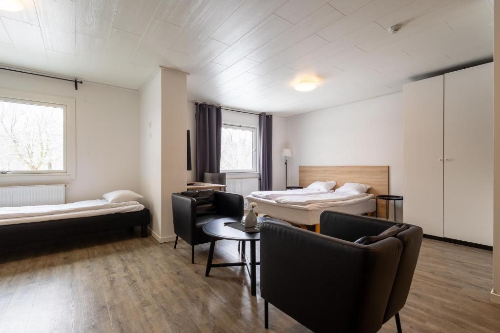 Postel nebo postele na pokoji v ubytování Halmstad Hotel Apartments