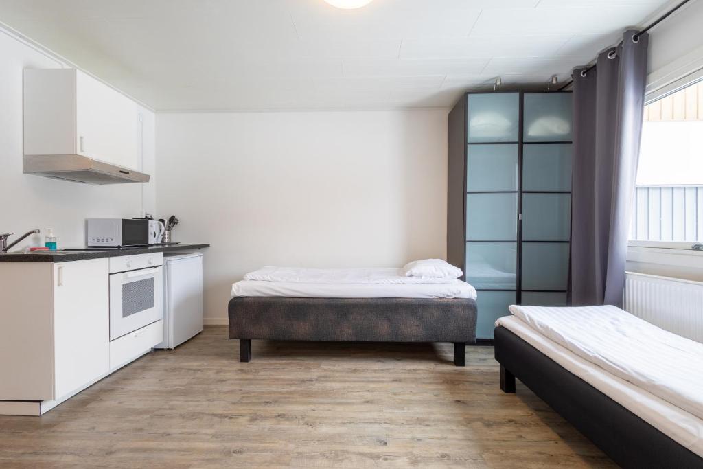 Kuchyň nebo kuchyňský kout v ubytování Halmstad Hotel Apartments