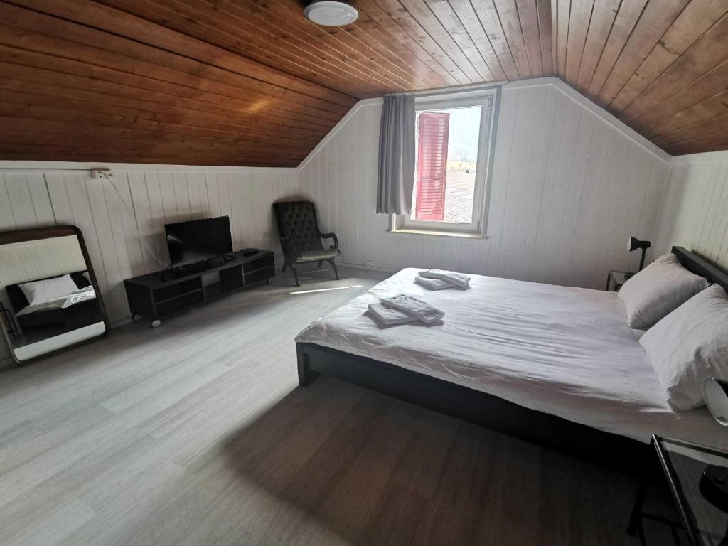 Postel nebo postele na pokoji v ubytování Hôtel du Crêt de l'Anneau