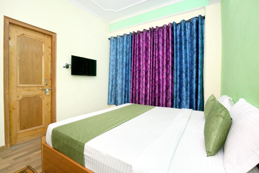 Katil atau katil-katil dalam bilik di Flagship Exotic View Homes