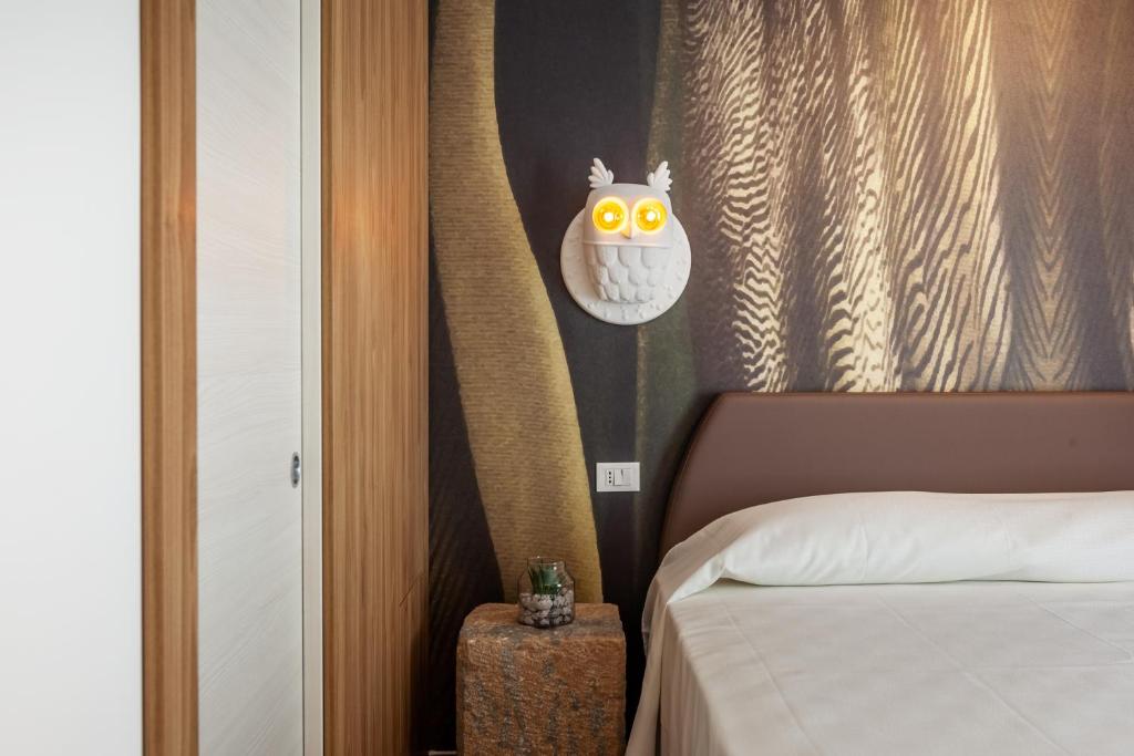 Łóżko lub łóżka w pokoju w obiekcie LA DAMA