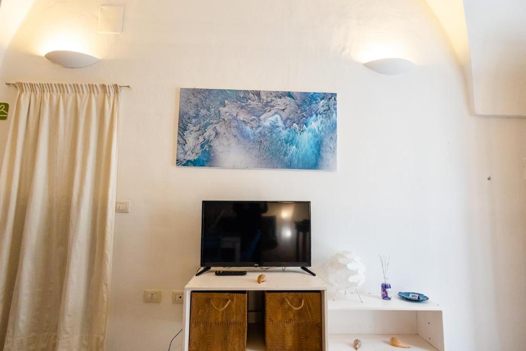 TV a/nebo společenská místnost v ubytování Blue Hole