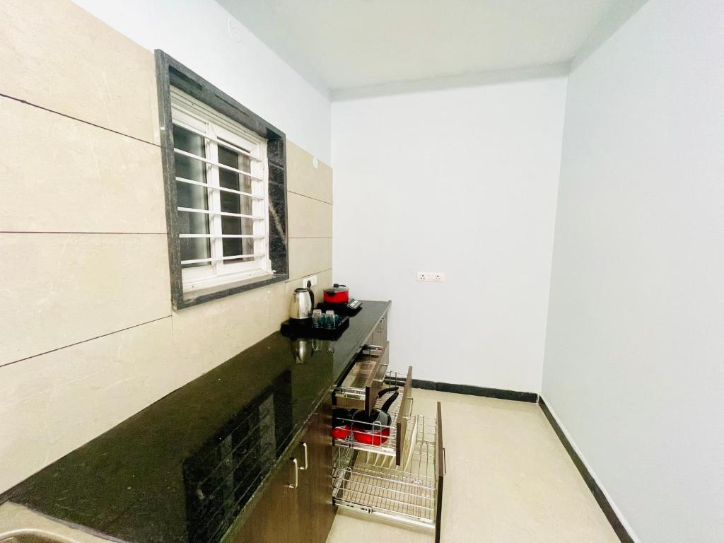 TV a/nebo společenská místnost v ubytování Deccan Suites, Tirupati
