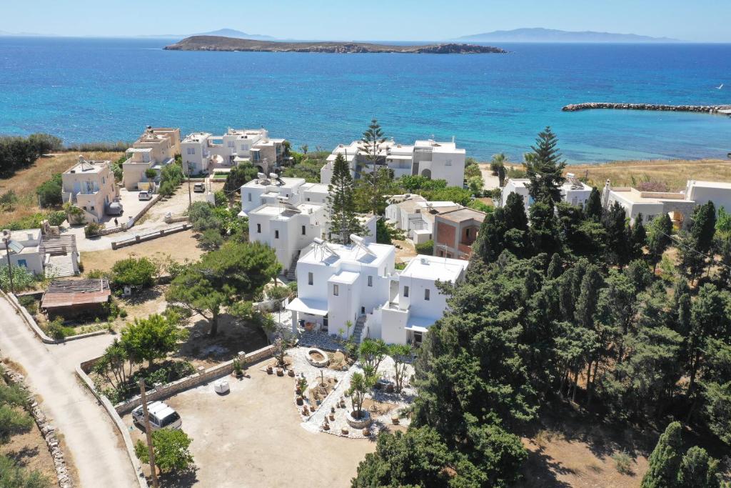 an aerial view of a white village by the ocean at Kiki's dream apartment balcony with sea views in Chrissi Akti