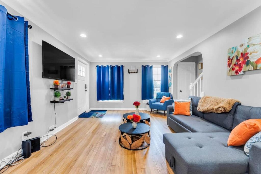 a living room with a couch and a table at Renovated Brooklyn Townhome 9 Miles from Downtown in Brooklyn