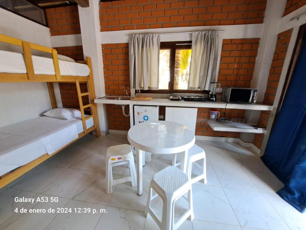 Postel nebo postele na pokoji v ubytování Punta Pacífico Bungalows Máncora