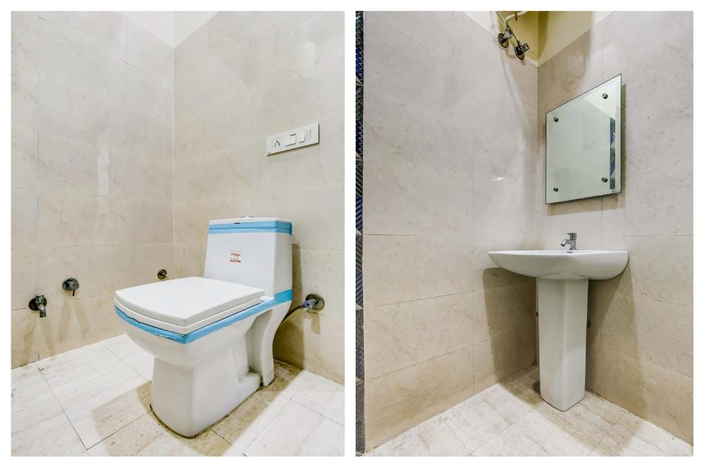 a bathroom with a toilet and a sink at Super OYO Flagship Hotel Sky Land in Ludhiana