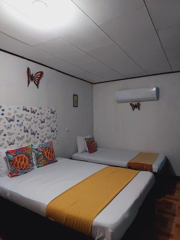Postel nebo postele na pokoji v ubytování Chinitas Eco Lodge