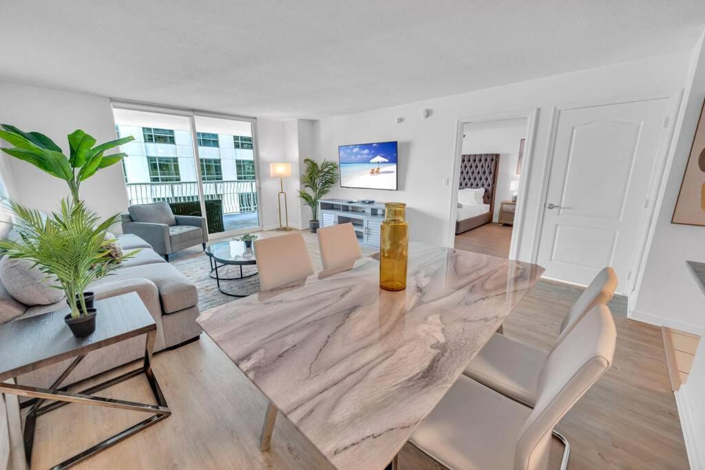 a living room with a dining table and a living room at Stunning 1 BDR 1 BTH • Brickell • Bay & City Views in Miami
