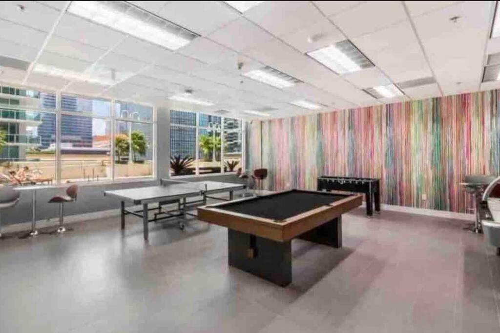 a billiard room with two tables and a pool table at Stunning 1 BDR 1 BTH • Brickell • Bay & City Views in Miami