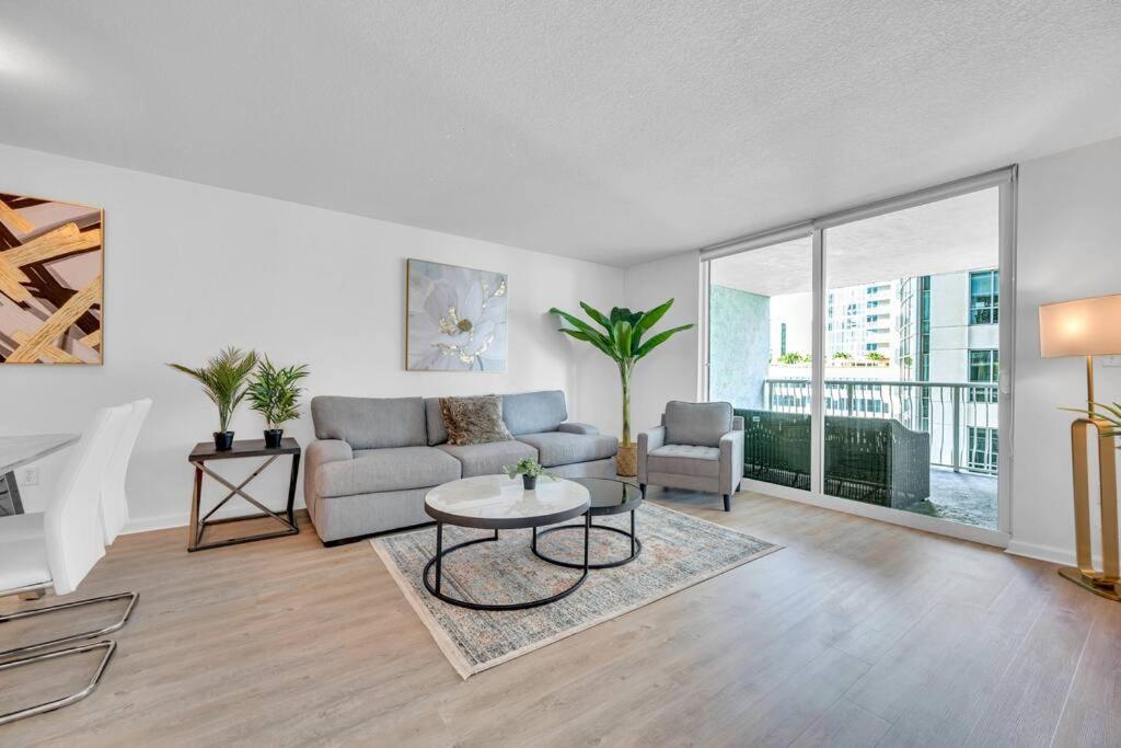 a living room with a couch and a table at Stunning 1 BDR 1 BTH • Brickell • Bay & City Views in Miami