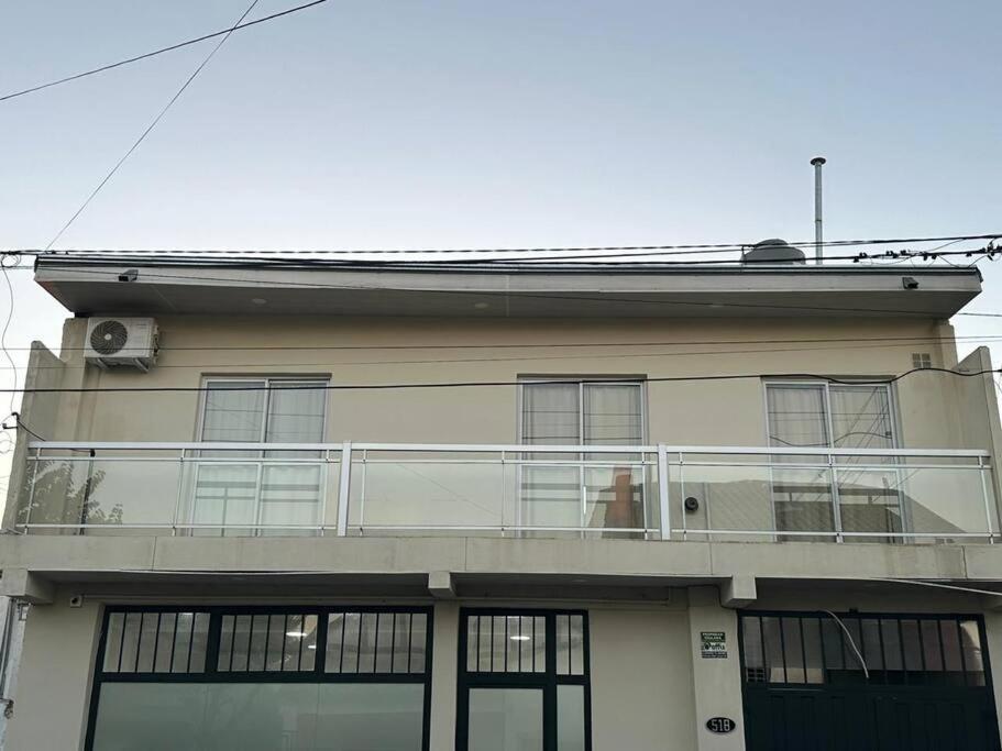 a building with a balcony on top of it at Concordia, Entre Rios in Concordia
