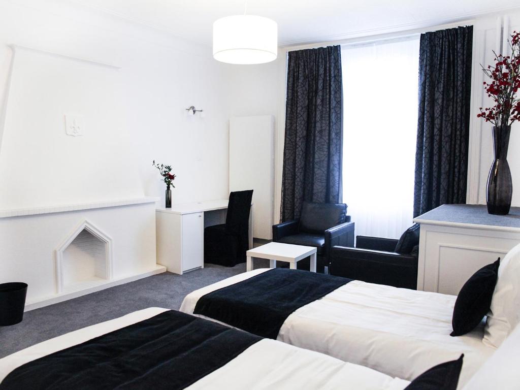 Postel nebo postele na pokoji v ubytování Hotel Satellite