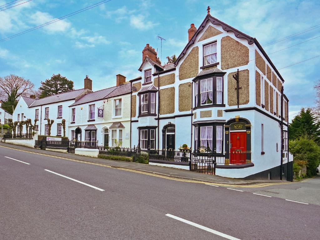 a row of houses on the side of a street at St Marys Chambers in Mold