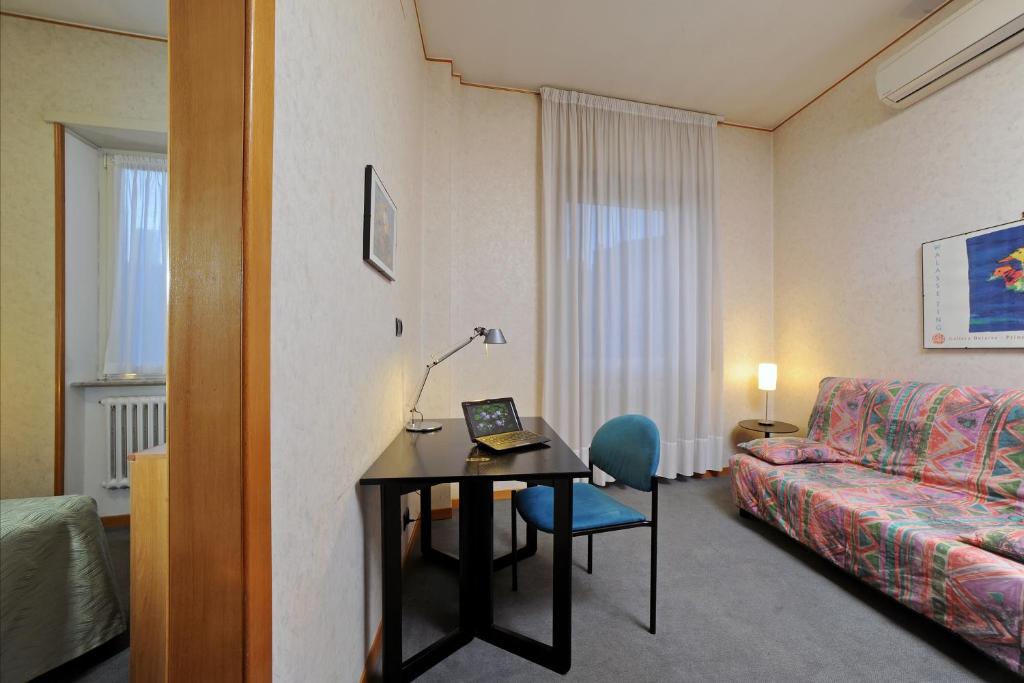 Postel nebo postele na pokoji v ubytování Tuscia Hotel