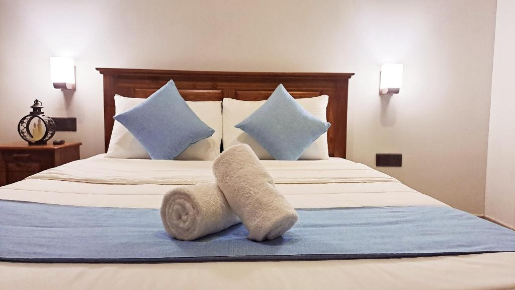 Postel nebo postele na pokoji v ubytování Golden Shower Inn